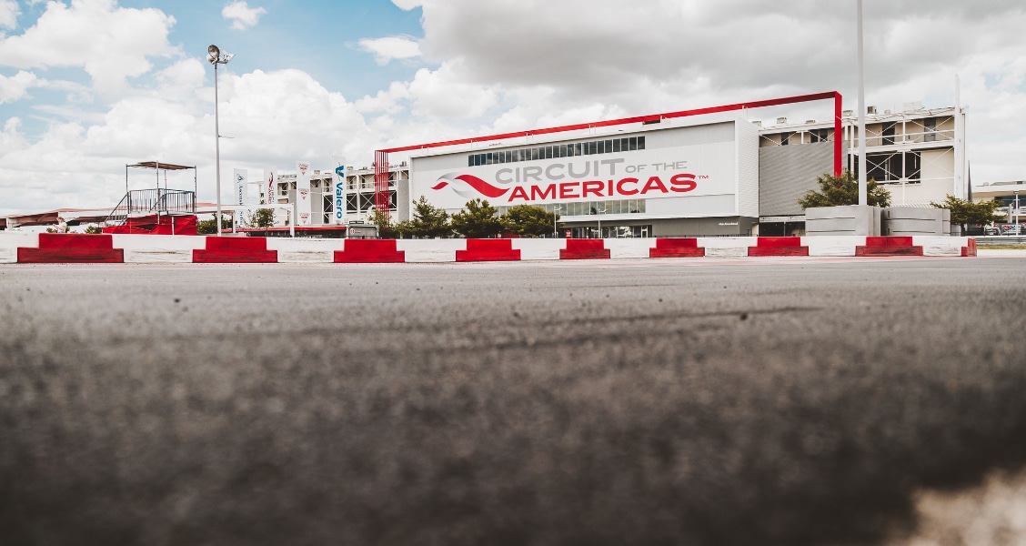 The COTA Karting track surface, barriers and Circuit of The Americas building