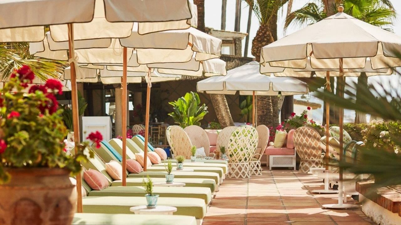Shaded loungers at Marbella Club Beach Club